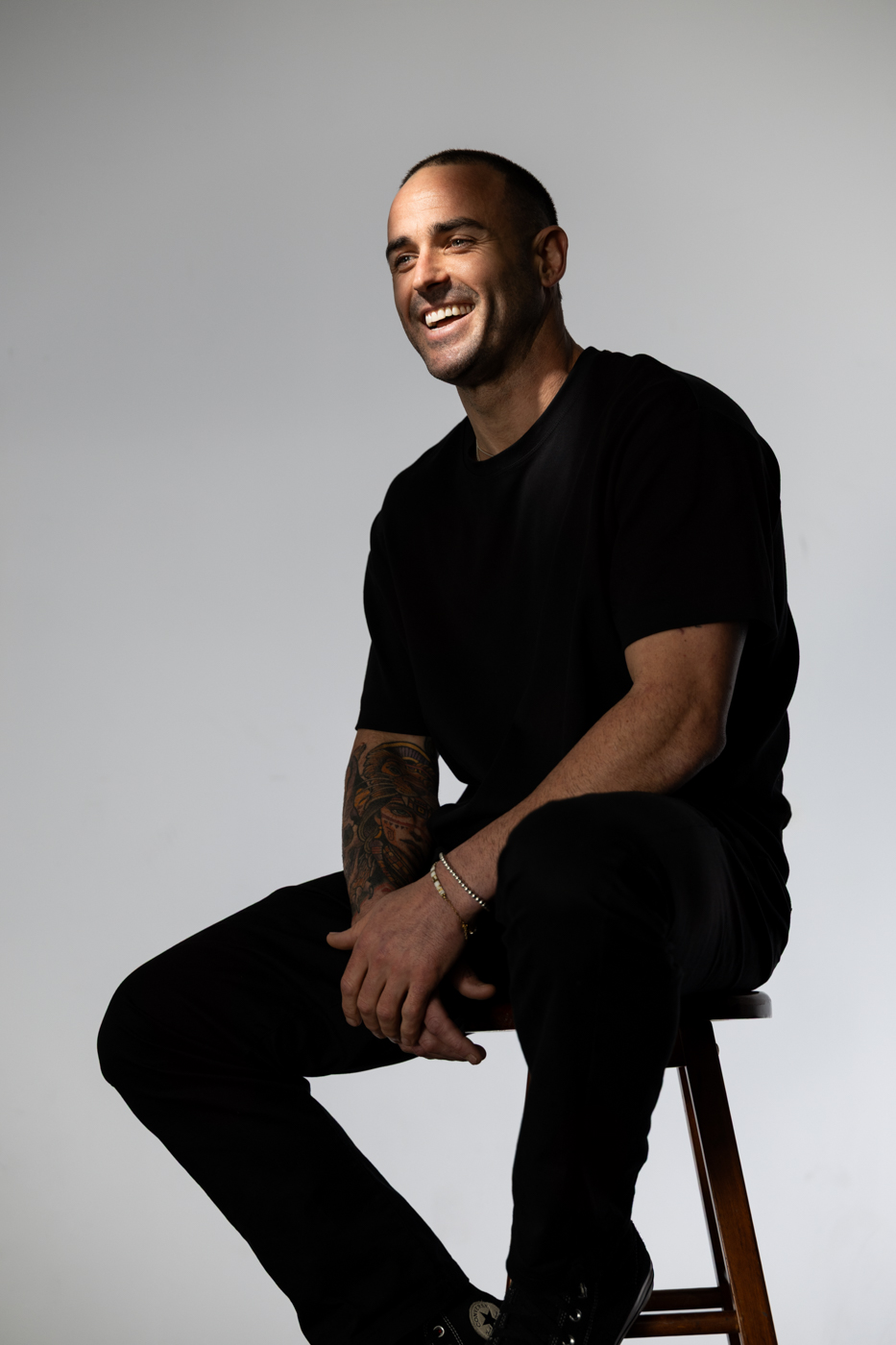Davey Lloyd smiling in a studio portrait