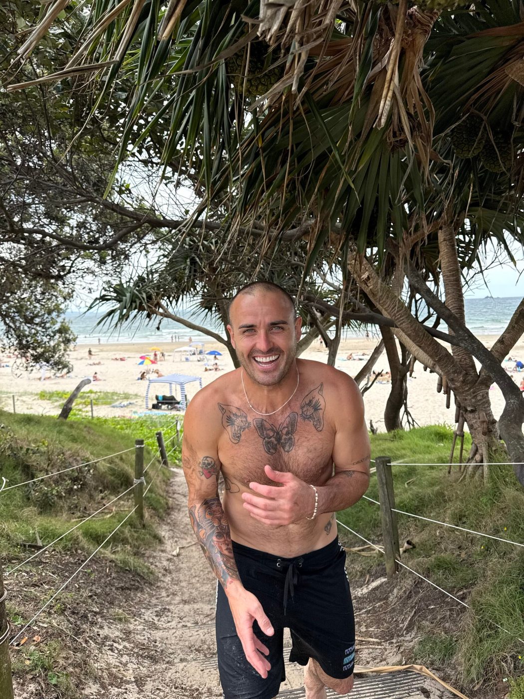 Davey Lloyd laughing on a beach track